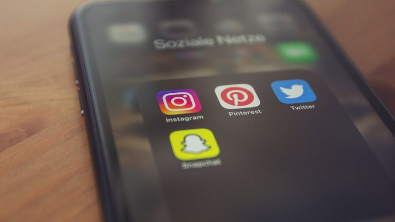 Smartphone screen displaying a folder of social media apps