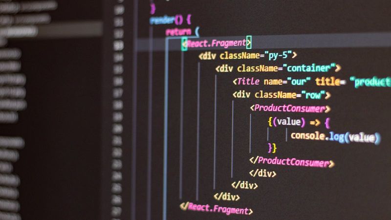 Black screen filled with JavaScript code illuminated in cool light