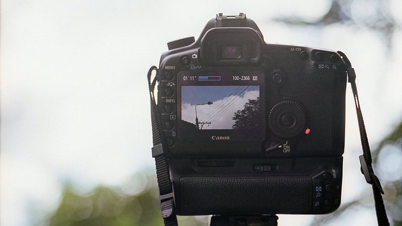Cinema camera with a large lens in a professional production setting