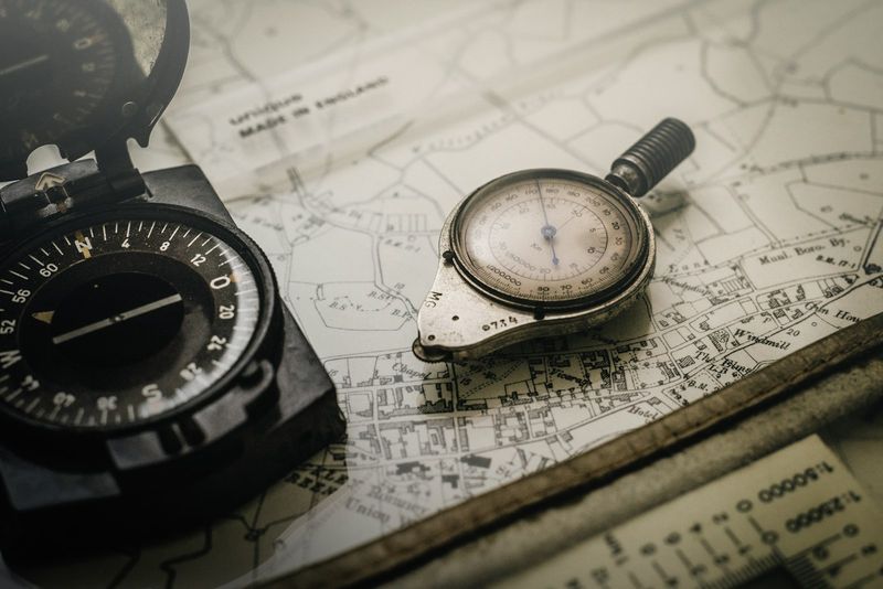 A compass resting on a map — steering a portfolio by a set heading rather than by hand
