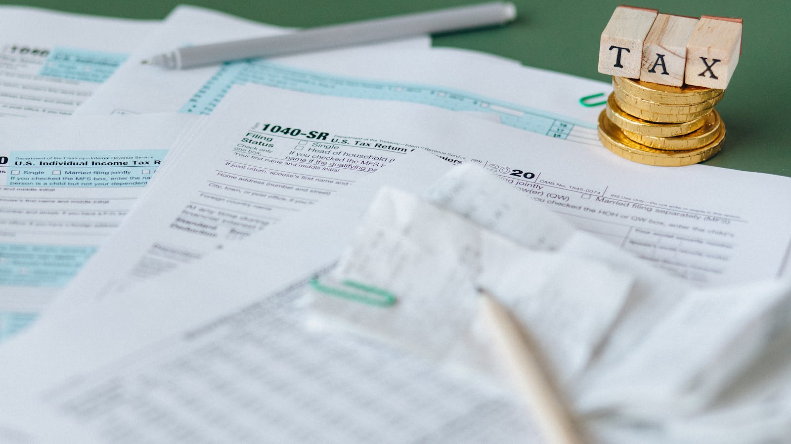 Tax documents and financial paperwork neatly arranged on a desk