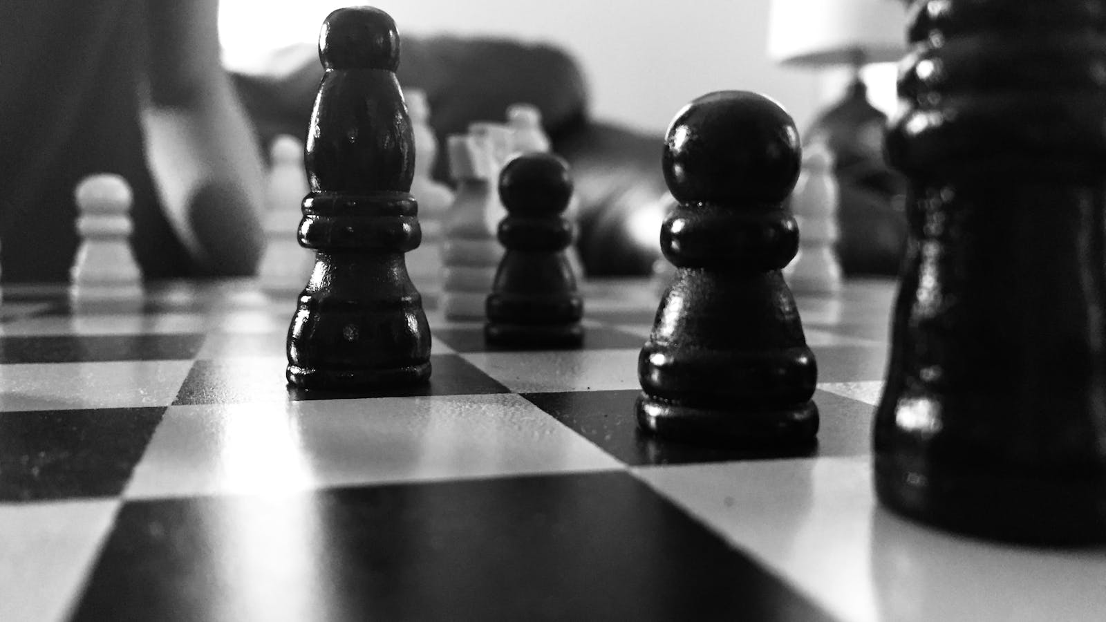 Chess pieces arranged on a board — strategic state, one move at a time